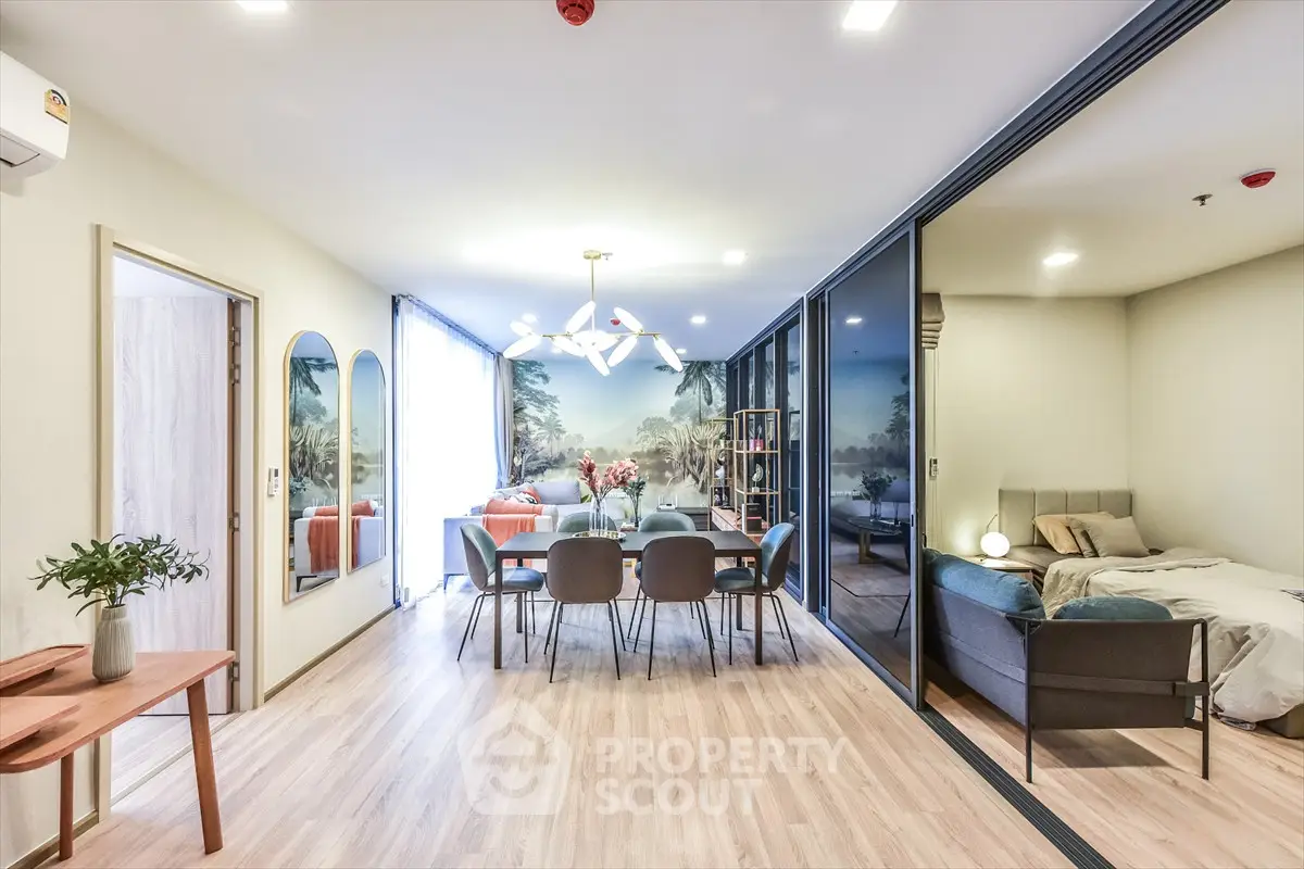 Spacious modern living room with dining area and bedroom in open layout apartment