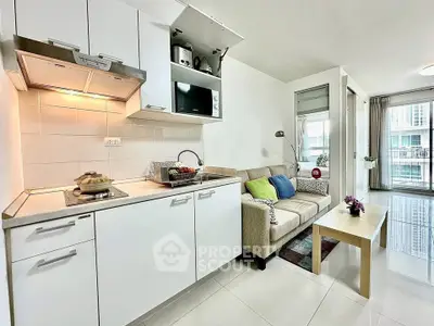 Modern open-layout kitchen and living room with sleek design and natural light