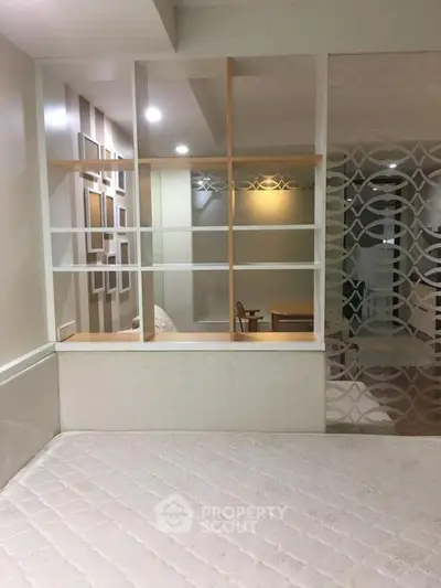 Modern bedroom with stylish partition and cozy decor