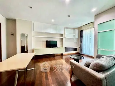 Spacious modern living room with hardwood floors and stylish furniture