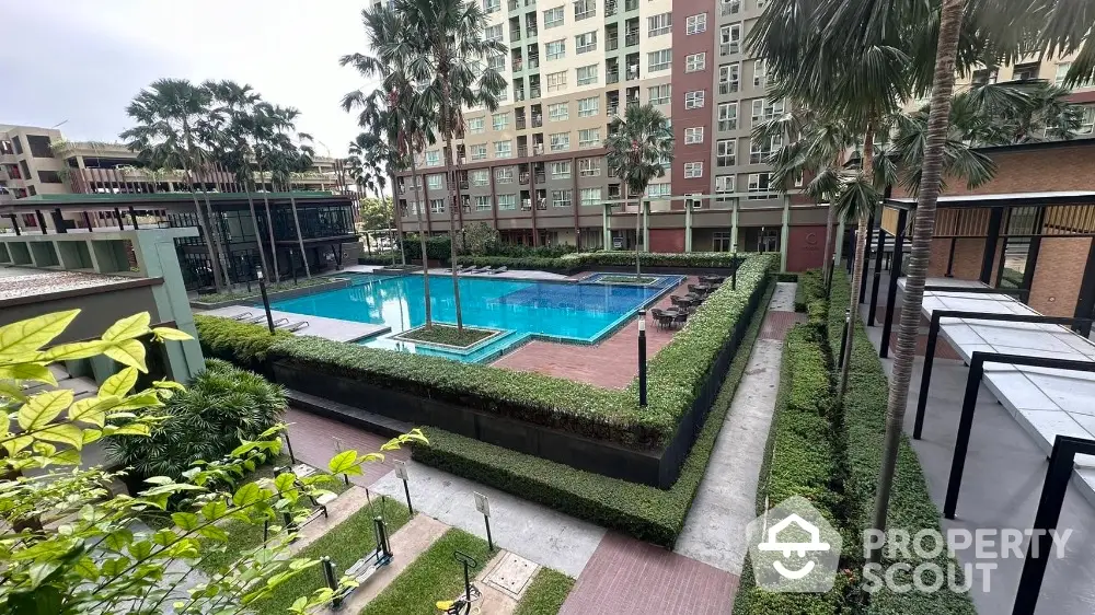 Luxurious condominium with stunning pool and lush landscaping