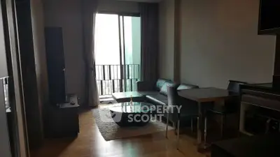 Modern living room with sleek furniture and balcony view