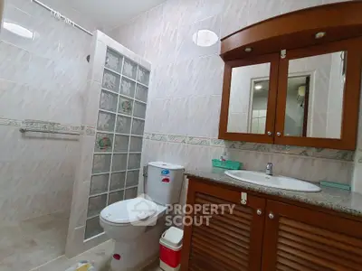 Spacious bathroom with modern fixtures and elegant tile design