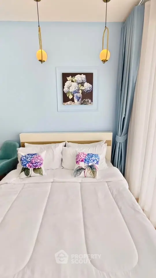 Elegant bedroom with floral decor and soft blue accents