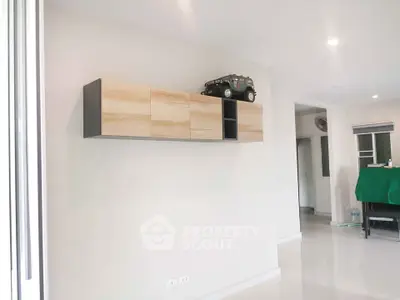 Modern living room with sleek wall-mounted storage and minimalist decor