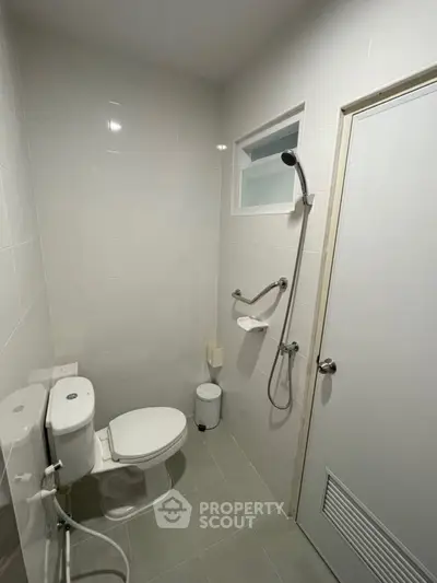 Modern bathroom with shower and toilet in minimalist design