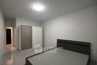Minimalist bedroom with sleek modern design and spacious wardrobe