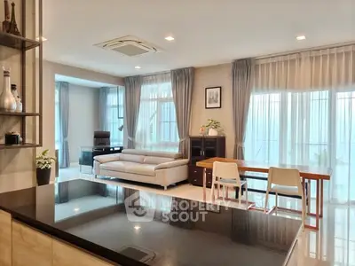 Spacious modern living room with elegant decor and ample natural light