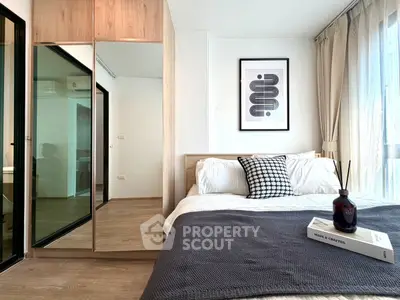 Modern bedroom with stylish decor and natural light