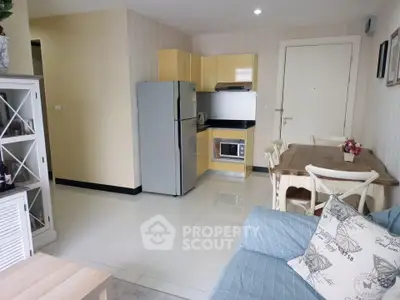 Charming open-layout kitchen and dining area with modern appliances and cozy seating.