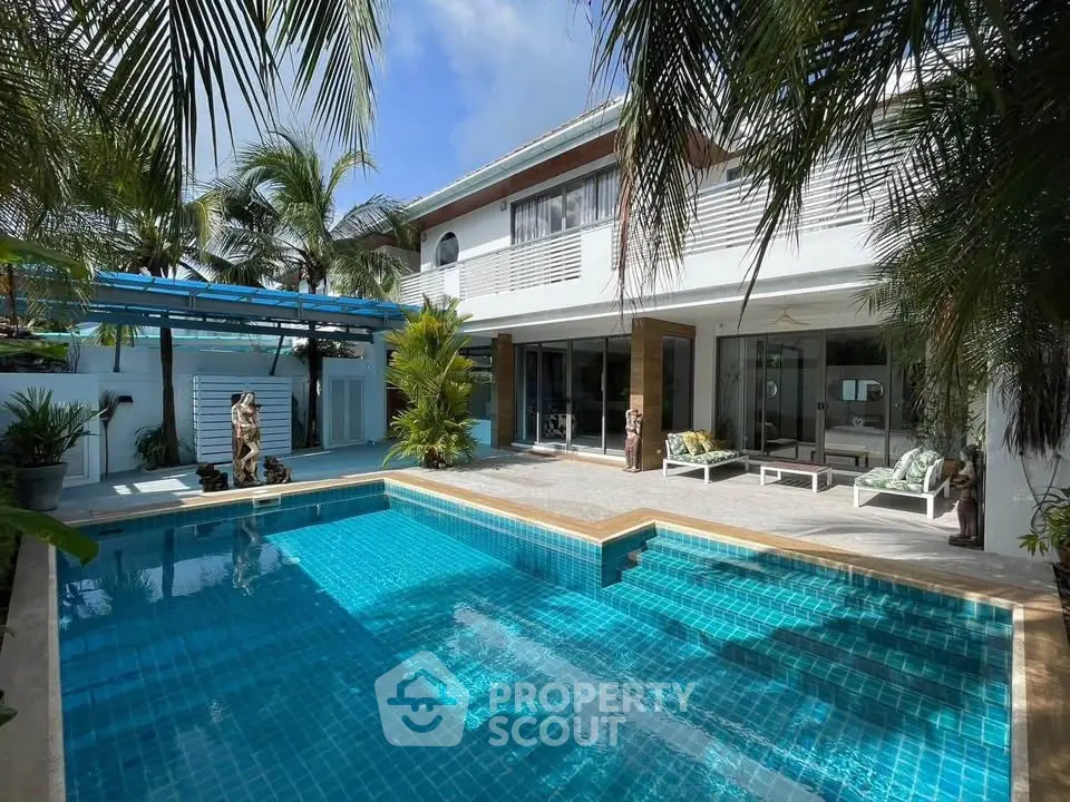 Luxurious tropical villa with private pool and lush garden, perfect for serene living.