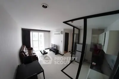 Modern living room with sleek design and glass partition in a stylish apartment