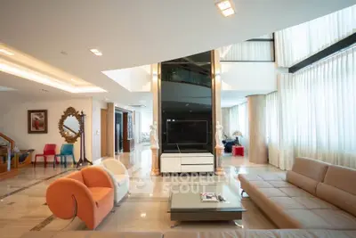 Luxurious modern living room with high ceilings and elegant decor
