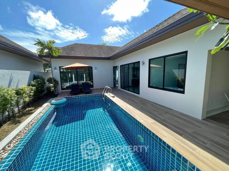 Luxurious villa with private pool and modern patio in tropical setting