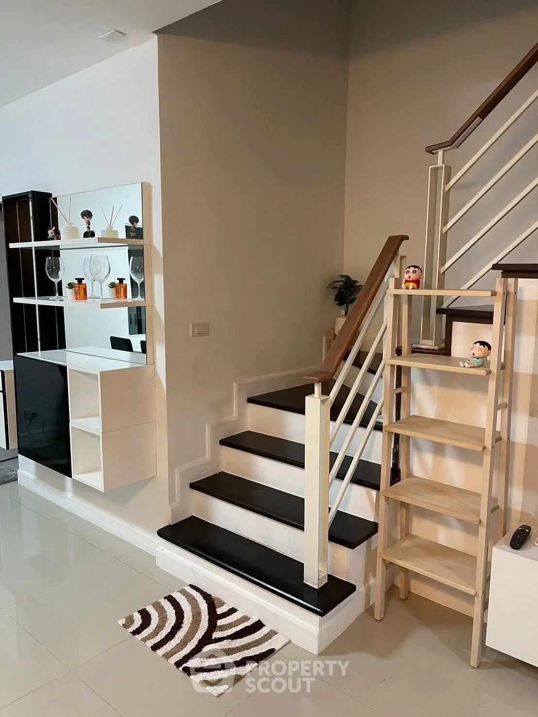 Stylish modern staircase with decorative shelving and sleek design