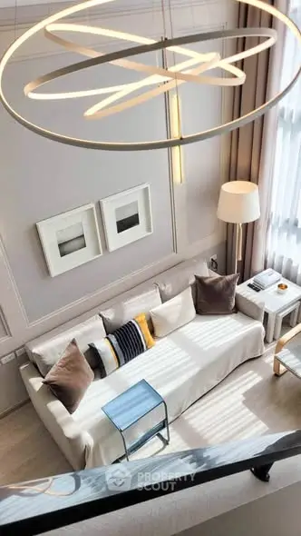 Modern living room with stylish decor and elegant lighting