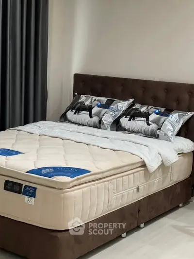 Luxurious bedroom with plush bed and elegant decor, perfect for relaxation and comfort.