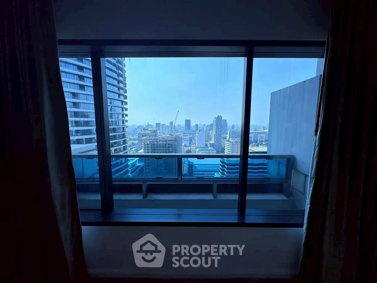 Stunning cityscape view from high-rise apartment balcony, perfect for urban living enthusiasts.