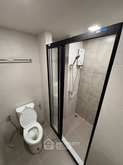 Modern bathroom with glass shower and sleek tile design