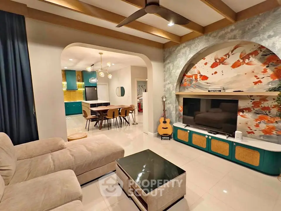 Stylish living room with modern decor, open layout, and vibrant wall art, perfect for contemporary living.