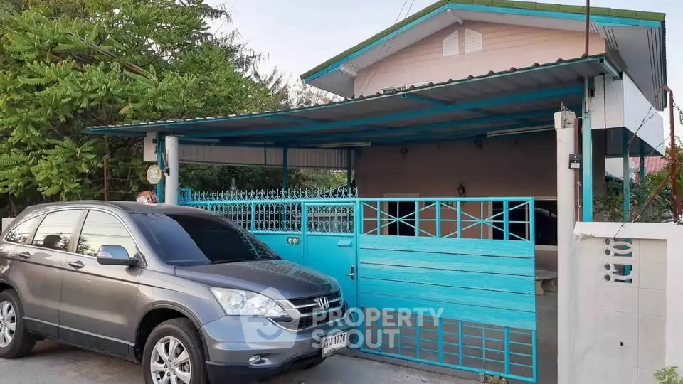 Charming suburban home with carport and gated entrance, perfect for family living.