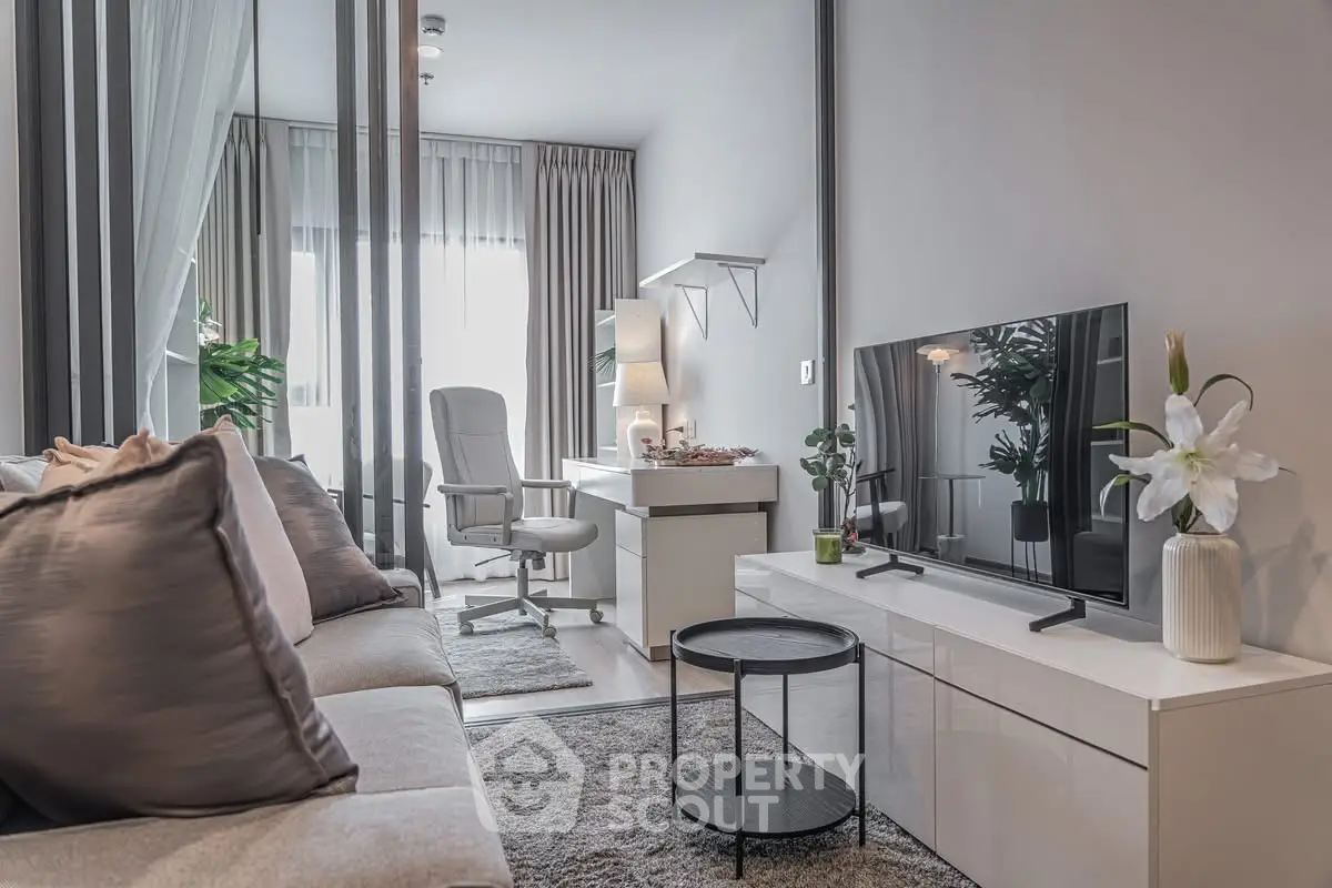 Modern living room with sleek furniture and natural light, perfect for urban living.