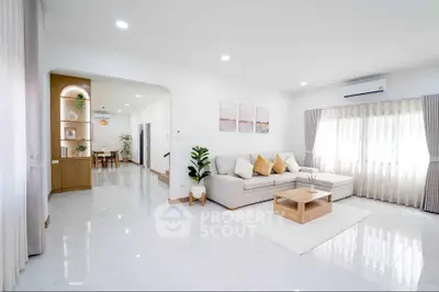Spacious modern living room with elegant decor and natural light