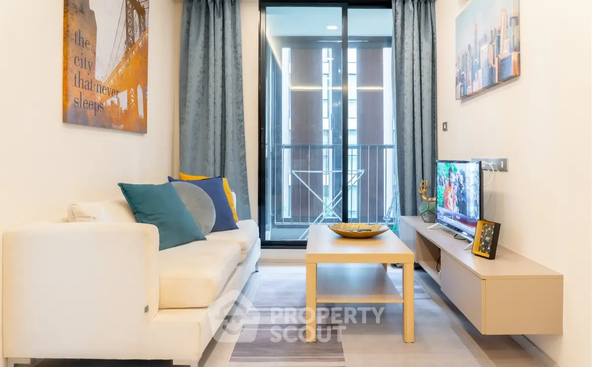 Modern living room with stylish decor and balcony view
