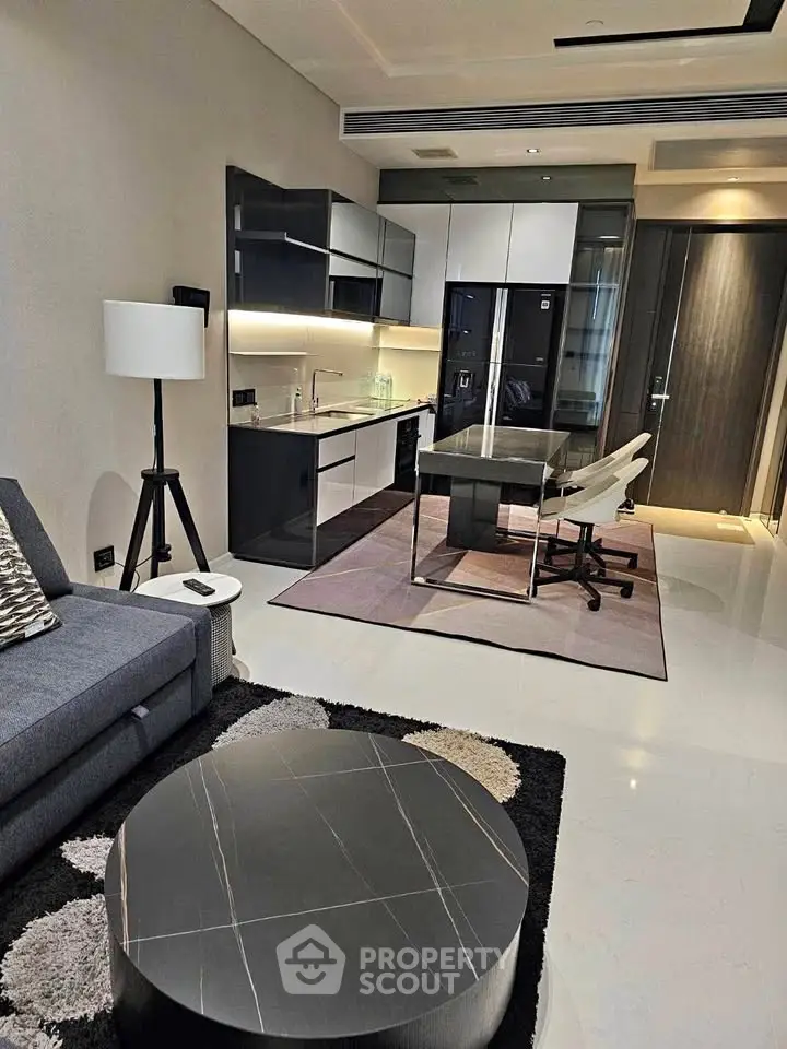 Modern open-layout living room with sleek kitchen and stylish furniture