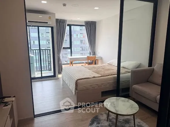 Modern bedroom with balcony view in stylish apartment