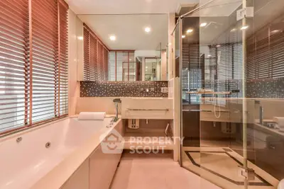 Luxurious bathroom with modern fixtures and glass shower enclosure