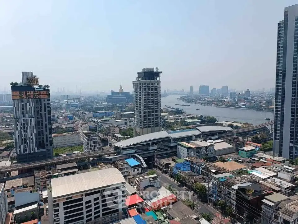 Stunning cityscape view with river and high-rise buildings, perfect for urban living enthusiasts.