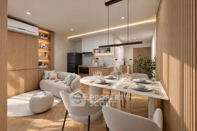 Modern open-plan living room and kitchen with elegant dining area and stylish decor.