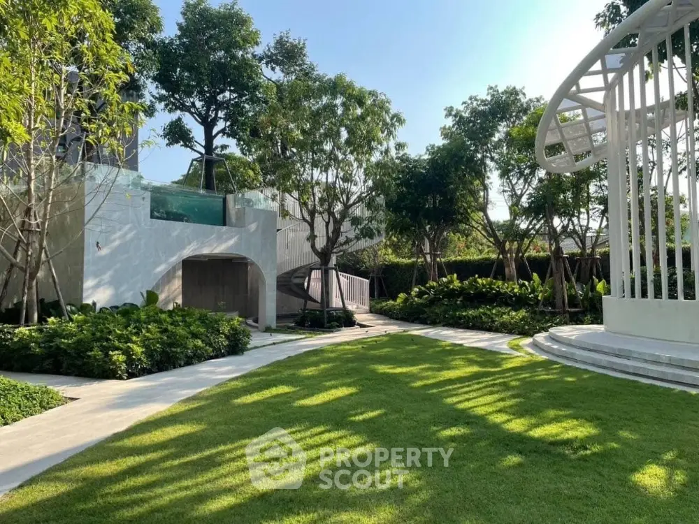 Luxurious garden with modern architecture and lush greenery, perfect for relaxation and outdoor activities.