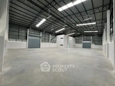 Spacious industrial warehouse with high ceilings and ample natural light
