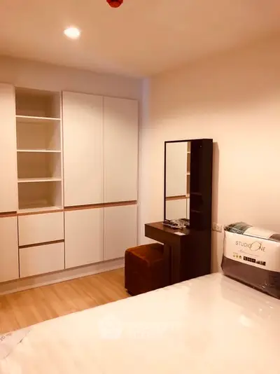 Cozy bedroom with modern furniture and ample storage space