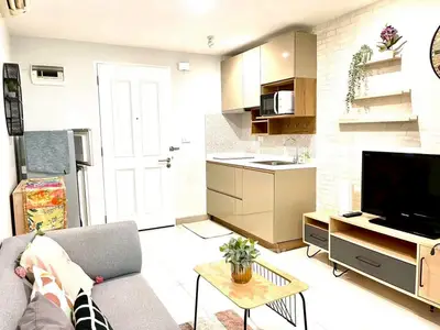 Modern living room with stylish furniture and open kitchen layout