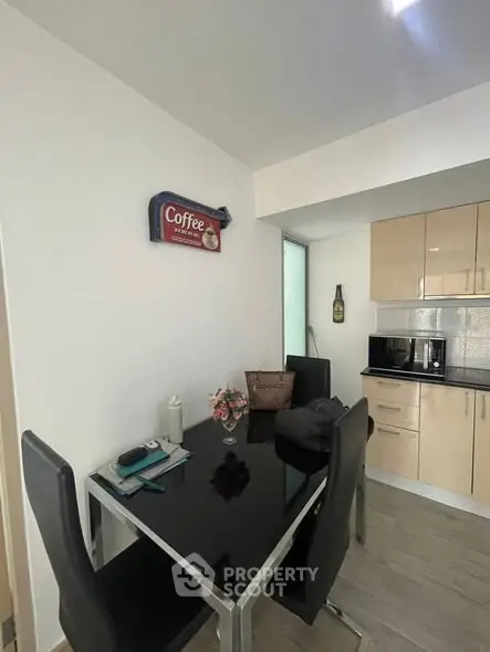 Modern kitchen with sleek black dining table and stylish decor