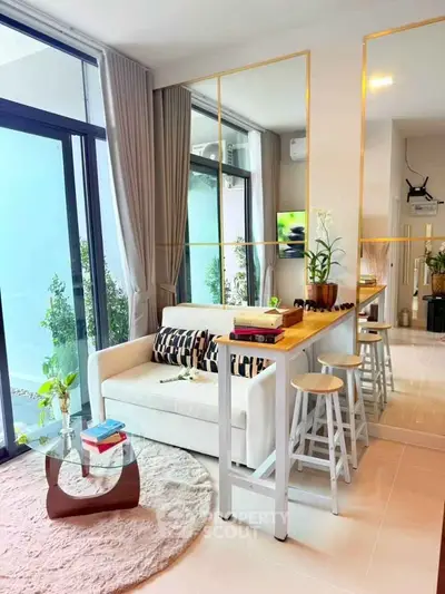 Stylish modern living room with large windows and elegant decor