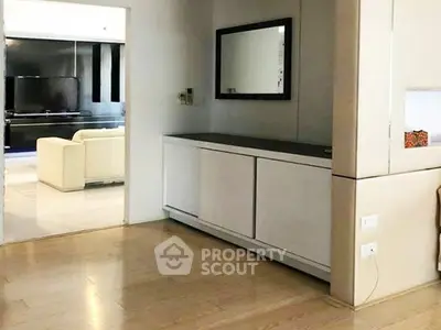 Spacious modern living room with sleek design and elegant furnishings.