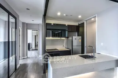 Modern kitchen with sleek design and open layout in contemporary apartment
