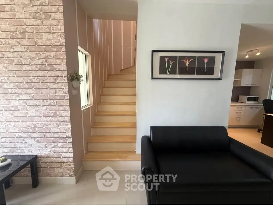 Stylish modern interior with staircase and cozy seating area