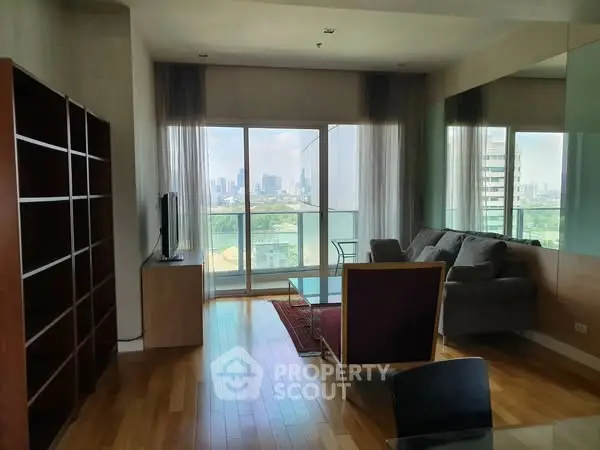 Spacious living room with city view and modern furnishings