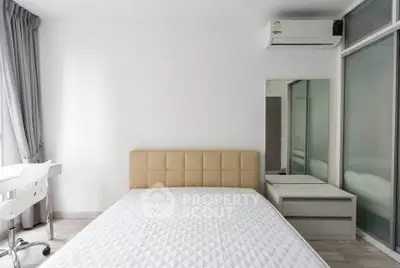 Modern bedroom with minimalist design, featuring a comfortable bed, sleek furniture, and ample natural light.