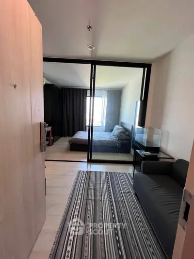 Modern apartment entrance with stylish decor and cozy bedroom view