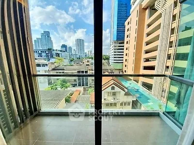 Spacious balcony with stunning city view in modern high-rise building