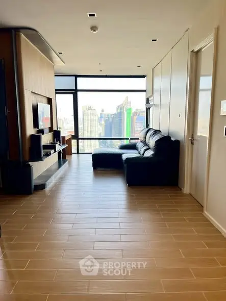 Modern living room with city view and sleek wooden flooring