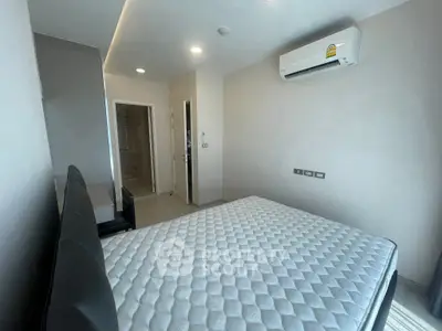 Modern bedroom with air conditioning and minimalist design in a contemporary apartment.