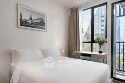 Modern bedroom with city view, featuring a cozy bed and stylish decor.