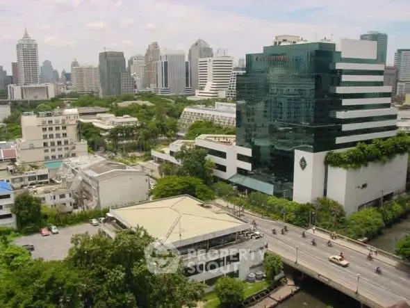Stunning cityscape view showcasing modern architecture and lush greenery in a vibrant urban setting.